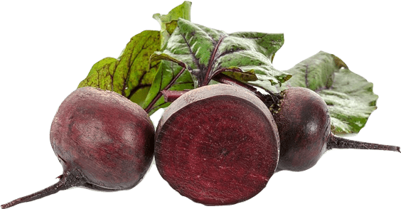 Three red beet roots in a pile with light green leaves. The central beet is cut open.