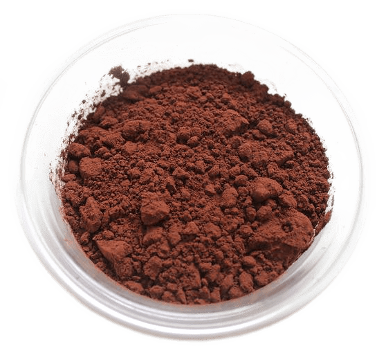 A small glass bowl filled with rich brown powdered cacao or cocoa.