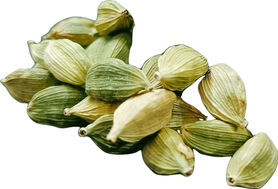 A small pile of light green and yellow cardamom seed pods.