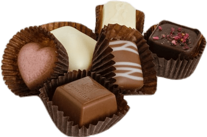 Six fancy chocolates from a luxury candy sampler, including white chocolate, pink chocolate, dark chocolate, and a caramel.