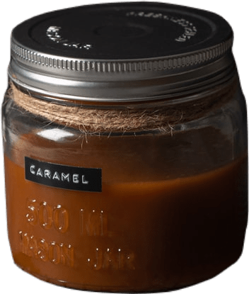 A glass jar with a metal lid wound with twine labeled caramel. It is full of medium-brown liquid.