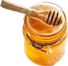 A glass jar of liquid honey wound with twine.