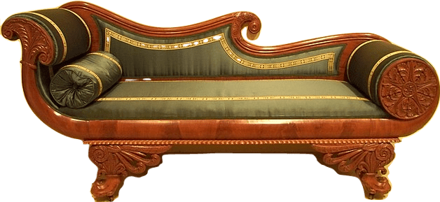 An ornate day bed made of carved mahogany, plush moss-green velvet, and gilded strips of decorative metal.