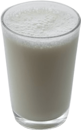 A foaming glass of milk filled to the brim.