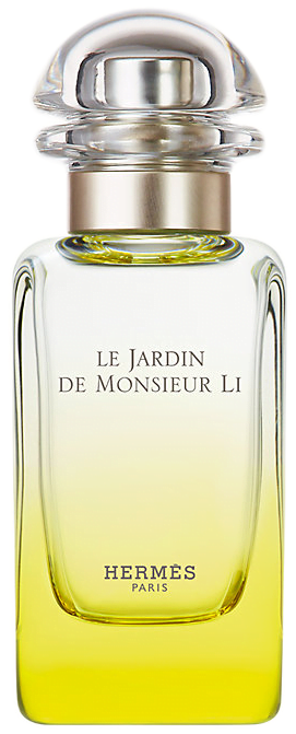 Clear yellow gradient glass bottle with a rounded silver cap of Le Jardin de Monsieur Li Eau de Toilette by Hermes.