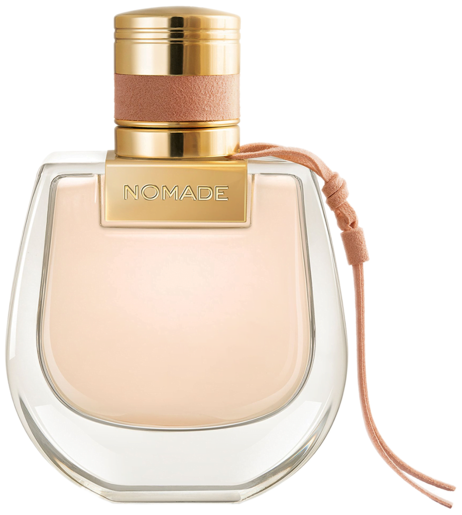 Bottle of Chloe's Nomade Eau de Toilette, shaped like the brand's iconic saddle bag and filled with light-peach-color liquid.