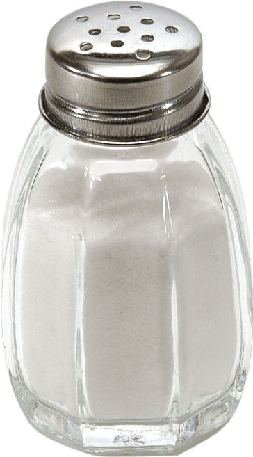 A glass shaker full of salt.