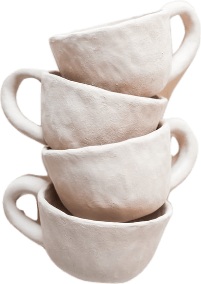 Four matte off-white stacked cups made of baked but unglazed stoneware clay.