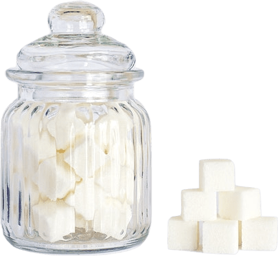 A ribbed glass jar filled with sugar cubes, with more sugar cubes stacked neatly beside it.