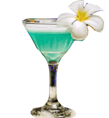 A teal-colored martini with a white layer on top , adorned with a large white frangipani flower with a bright yellow center.