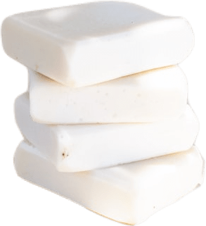 A pile of four square white bars of soap.