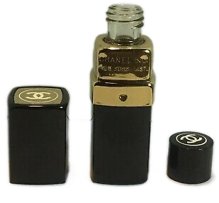 A miniature perfume bottle shaped like a black rectangular lipstick case.