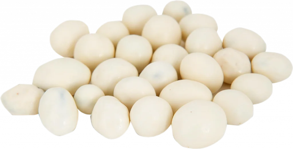 A loose handful of white yogurt-candy-coated raisins.