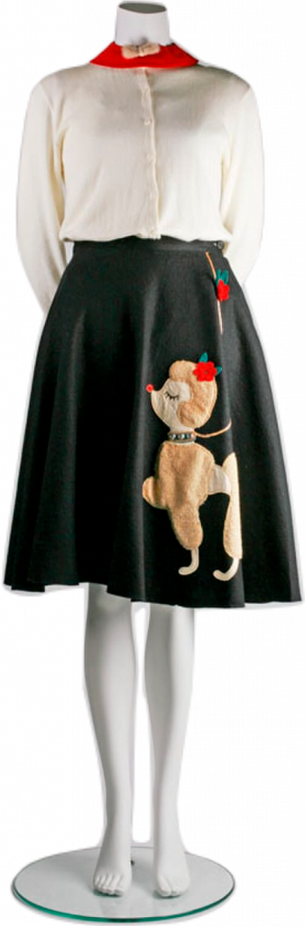 A dress form wearing a white buttoned sweater and a flowy black poodle skirt with a picture of a flouncy brown poodle.