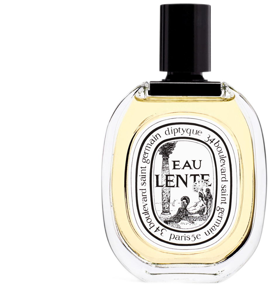 Clear oval bottle with white illustrated label filled with pale yellow liquid Eau Lente Eau de Toilette Diptyque.