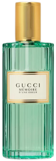 Tall vintage-style ribbed clear aqua-colored glass bottle of Memoire d'une Odeur by Gucci with a gold cap.