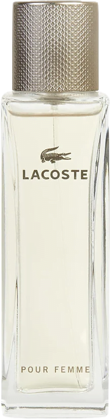 A tall rectangular glass bottle of Lacoste Pour Femme, filled with cream-colored perfume, topped with a silver cylinder cap.