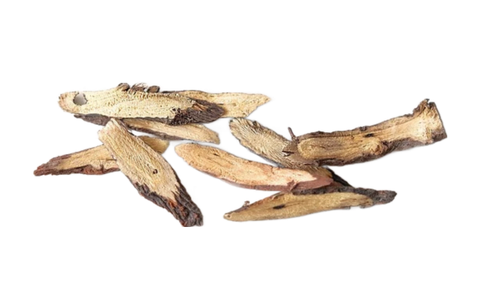 A pile of dried light brown roots of licorice, also known as Spanish wood.