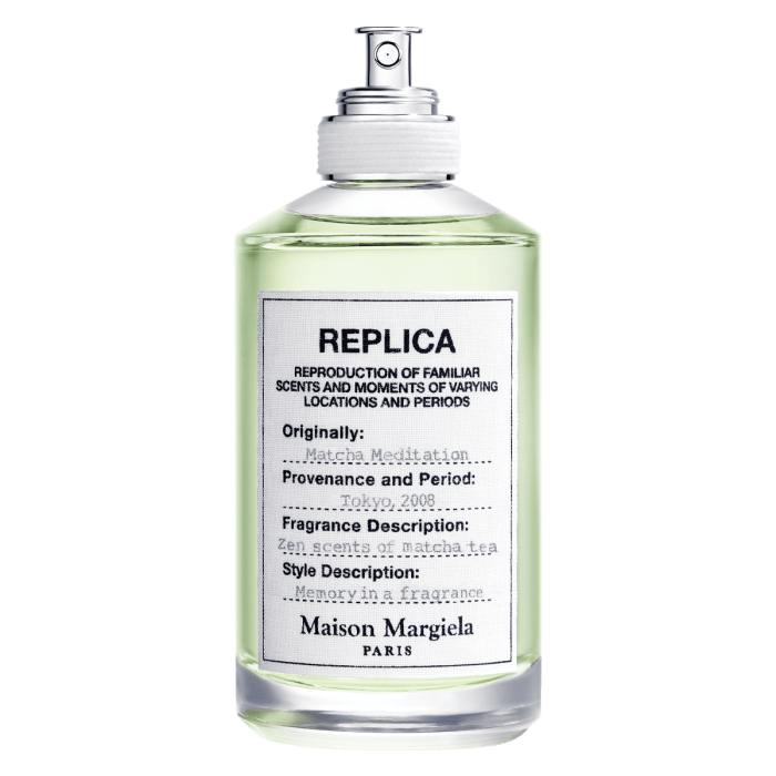 Clear glass bottle with white label filled with green Matcha Meditation Eau de Toilette by Maison Martin Margiela perfume.