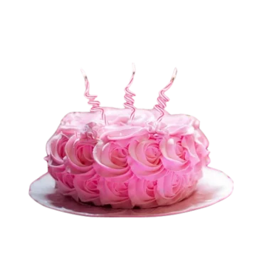 A lush birthday cake covered with pink buttercream roses and topped by three lit candles.